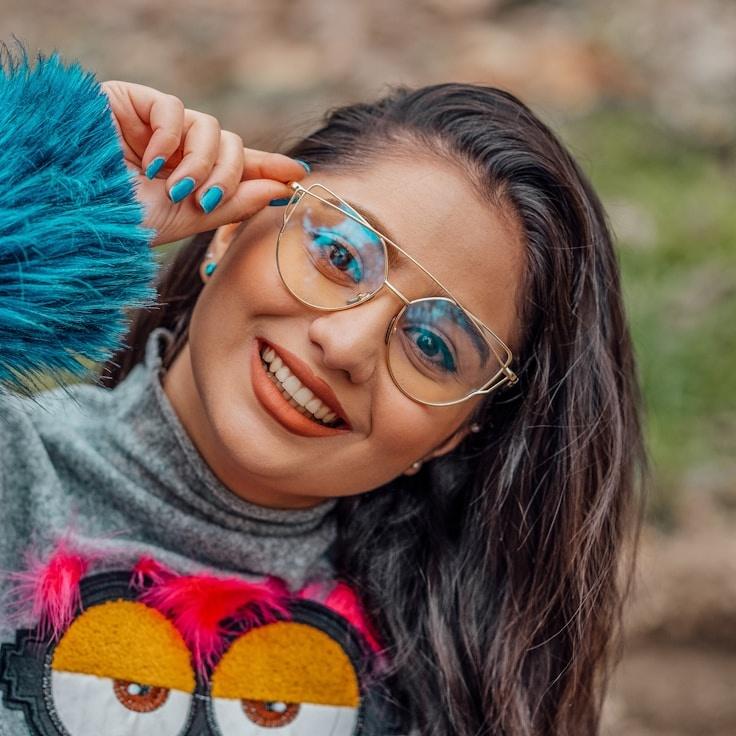 Anya Rao, Lead Design Curator at PlanetGardenFrame, reviewing corporate floral arrangements